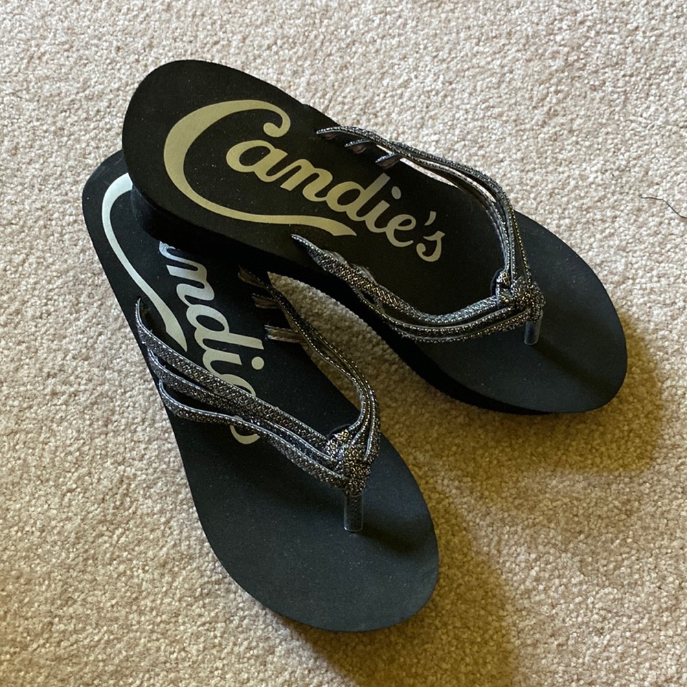 Candies wedge black flip flops. Silver metallic straps. Size 7.5 Worn once.